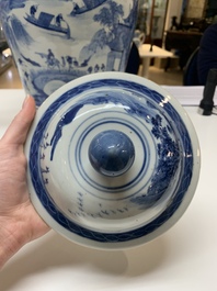 A near pair of Chinese blue and white 'landscape' vases and covers, 19th C.