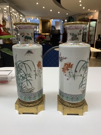 A pair of Chinese famille rose gilt-bronze-mounted 'birds among flowering branches' vases, 19th C.
