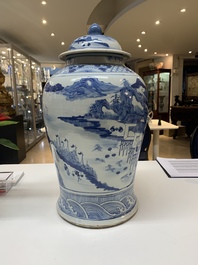 A near pair of Chinese blue and white 'landscape' vases and covers, 19th C.