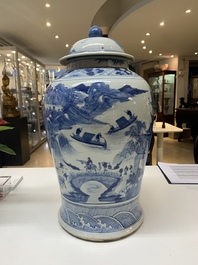 A near pair of Chinese blue and white 'landscape' vases and covers, 19th C.