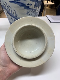 A near pair of Chinese blue and white 'landscape' vases and covers, 19th C.