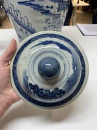 A near pair of Chinese blue and white 'landscape' vases and covers, 19th C.
