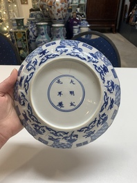 A Chinese blue and white 'erotic scene' plate, Kangxi