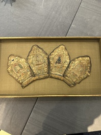A framed Tibetan silk-embroidered four-leaf ritual crown with Transcendent Buddhas, Tibet, 18th C.