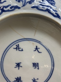 A Chinese blue and white 'erotic scene' plate, Kangxi
