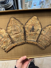 A framed Tibetan silk-embroidered four-leaf ritual crown with Transcendent Buddhas, Tibet, 18th C.