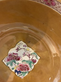 A Chinese famille rose capucin-brown-ground bowl and two plates, Qianlong