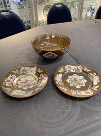 A Chinese famille rose capucin-brown-ground bowl and two plates, Qianlong