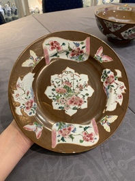 A Chinese famille rose capucin-brown-ground bowl and two plates, Qianlong