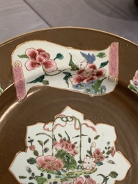 A Chinese famille rose capucin-brown-ground bowl and two plates, Qianlong