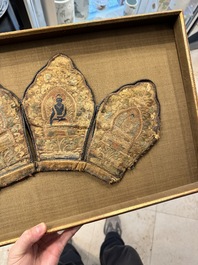 A framed Tibetan silk-embroidered four-leaf ritual crown with Transcendent Buddhas, Tibet, 18th C.