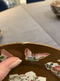 A Chinese famille rose capucin-brown-ground bowl and two plates, Qianlong