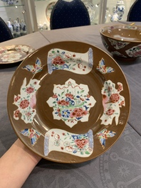 A Chinese famille rose capucin-brown-ground bowl and two plates, Qianlong