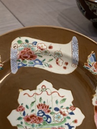 A Chinese famille rose capucin-brown-ground bowl and two plates, Qianlong