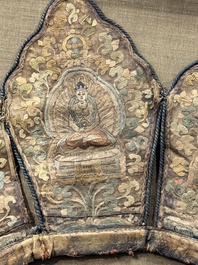 A framed Tibetan silk-embroidered four-leaf ritual crown with Transcendent Buddhas, Tibet, 18th C.
