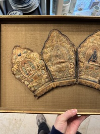 A framed Tibetan silk-embroidered four-leaf ritual crown with Transcendent Buddhas, Tibet, 18th C.