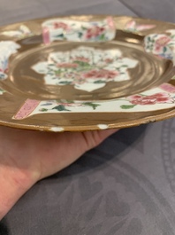 A Chinese famille rose capucin-brown-ground bowl and two plates, Qianlong