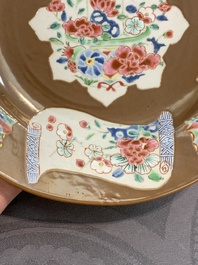 A Chinese famille rose capucin-brown-ground bowl and two plates, Qianlong