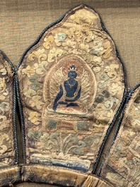 A framed Tibetan silk-embroidered four-leaf ritual crown with Transcendent Buddhas, Tibet, 18th C.