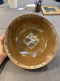 A Chinese famille rose capucin-brown-ground bowl and two plates, Qianlong