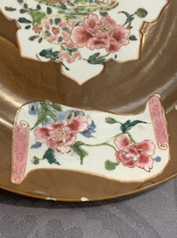 A Chinese famille rose capucin-brown-ground bowl and two plates, Qianlong