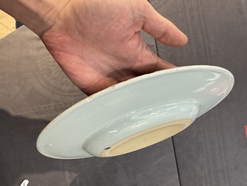 A large Chinese blue and white armorial dish with the arms of the Coelho family, Kangxi
