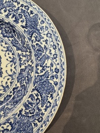 A large Chinese blue and white armorial dish with the arms of the Coelho family, Kangxi