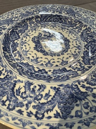 A large Chinese blue and white armorial dish with the arms of the Coelho family, Kangxi