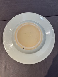 A large Chinese blue and white armorial dish with the arms of the Coelho family, Kangxi