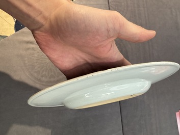A large Chinese blue and white armorial dish with the arms of the Coelho family, Kangxi