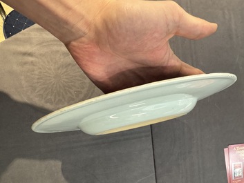 A large Chinese blue and white armorial dish with the arms of the Coelho family, Kangxi