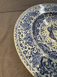 A large Chinese blue and white armorial dish with the arms of the Coelho family, Kangxi