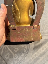 A fine Chinese gilt bronze Buddha, Qianlong mark and of the period
