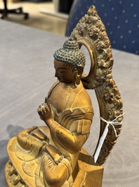 A fine Chinese gilt bronze Buddha, Qianlong mark and of the period