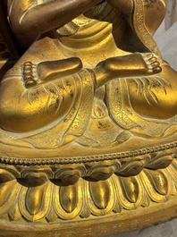 A fine Chinese gilt bronze Buddha, Qianlong mark and of the period