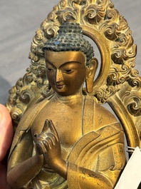 A fine Chinese gilt bronze Buddha, Qianlong mark and of the period
