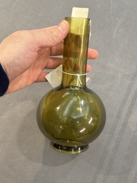 A rare Chinese translucent green Peking glass bottle vase, Qianlong mark and of the period
