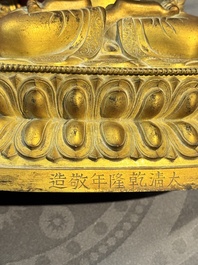 A fine Chinese gilt bronze Buddha, Qianlong mark and of the period