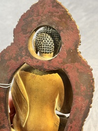A fine Chinese gilt bronze Buddha, Qianlong mark and of the period