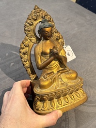 A fine Chinese gilt bronze Buddha, Qianlong mark and of the period