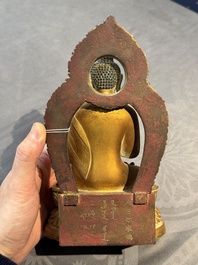 A fine Chinese gilt bronze Buddha, Qianlong mark and of the period