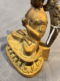 A fine Chinese gilt bronze Buddha, Qianlong mark and of the period