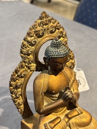 A fine Chinese gilt bronze Buddha, Qianlong mark and of the period