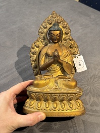 A fine Chinese gilt bronze Buddha, Qianlong mark and of the period