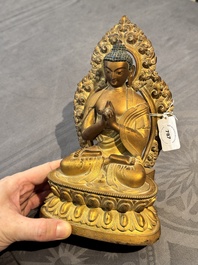 A fine Chinese gilt bronze Buddha, Qianlong mark and of the period