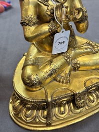 A Sino-Tibetan gilt bronze Virūpa, 19th C.