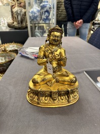 A Sino-Tibetan gilt bronze Virūpa, 19th C.
