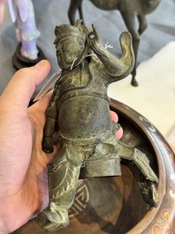A Vietnamese bronze brush washer on stand and a Chinese bronze warrior on horseback, 19th C.