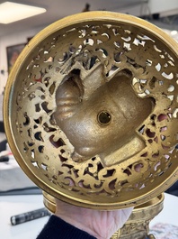 A large Chinese precious stone-inlaid gilt bronze 'elephant' tripod censer and cover on wooden stand, 19th C.