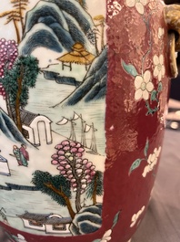 A pair of Chinese famille rose ruby-ground 'landscape' vases, 19th C.